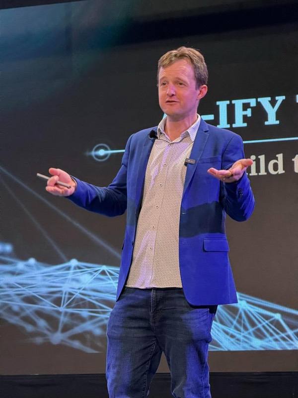 Brad Hart speaking on stage